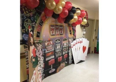 Giant slot machine and balloons for poker activity